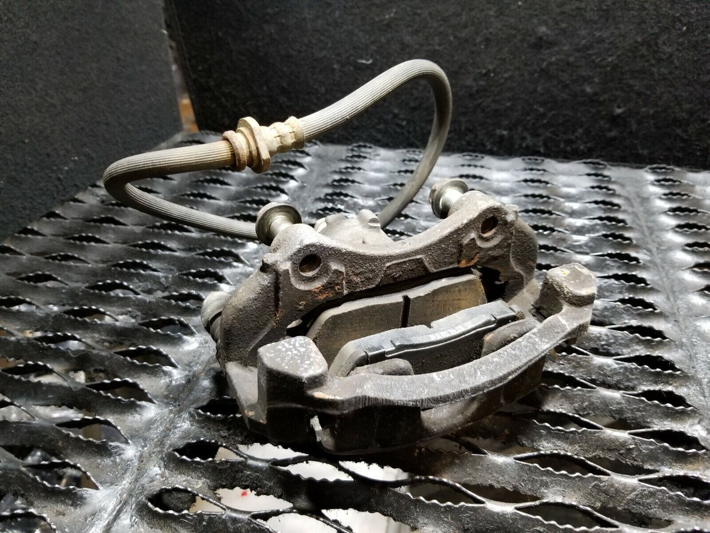 13 14 15 16 Nissan Versa Front Left Driver Side Bracke Caliper OEM