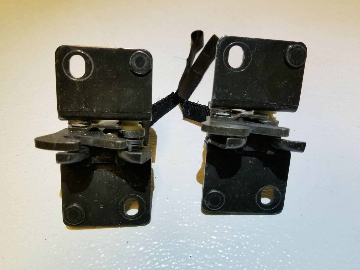 04 05 06 07 08 Nissan Maxima Rear Seat Fold Lock Pair OEM