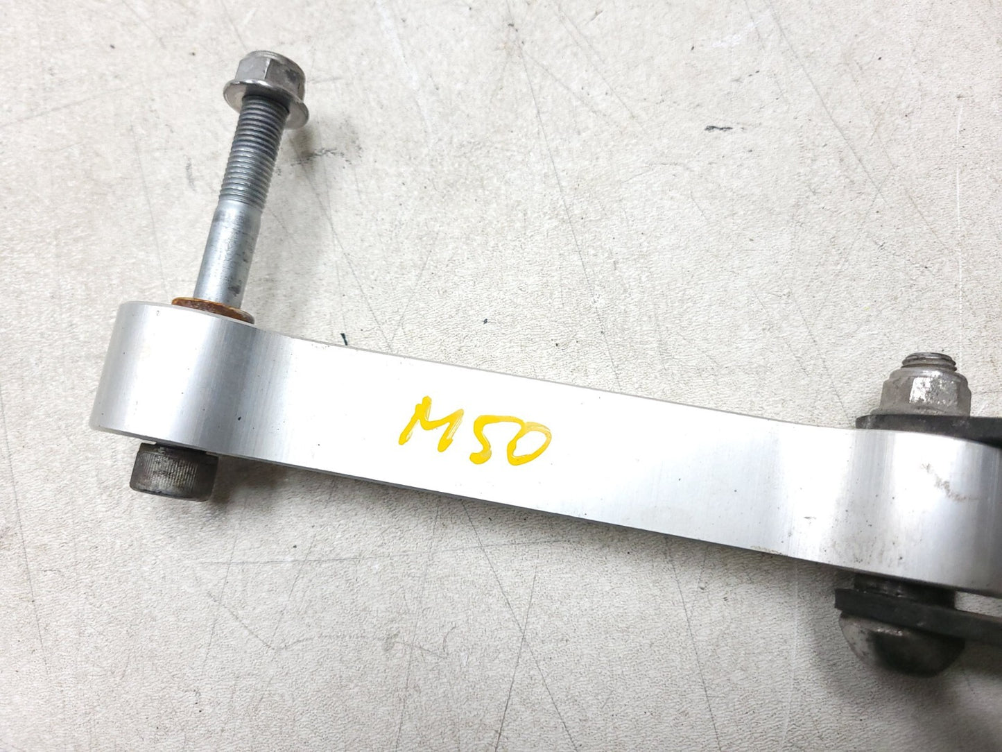 2009 - 2012 Triumph Street Triple R Rear Shock Linkage Dogbone Arm OEM