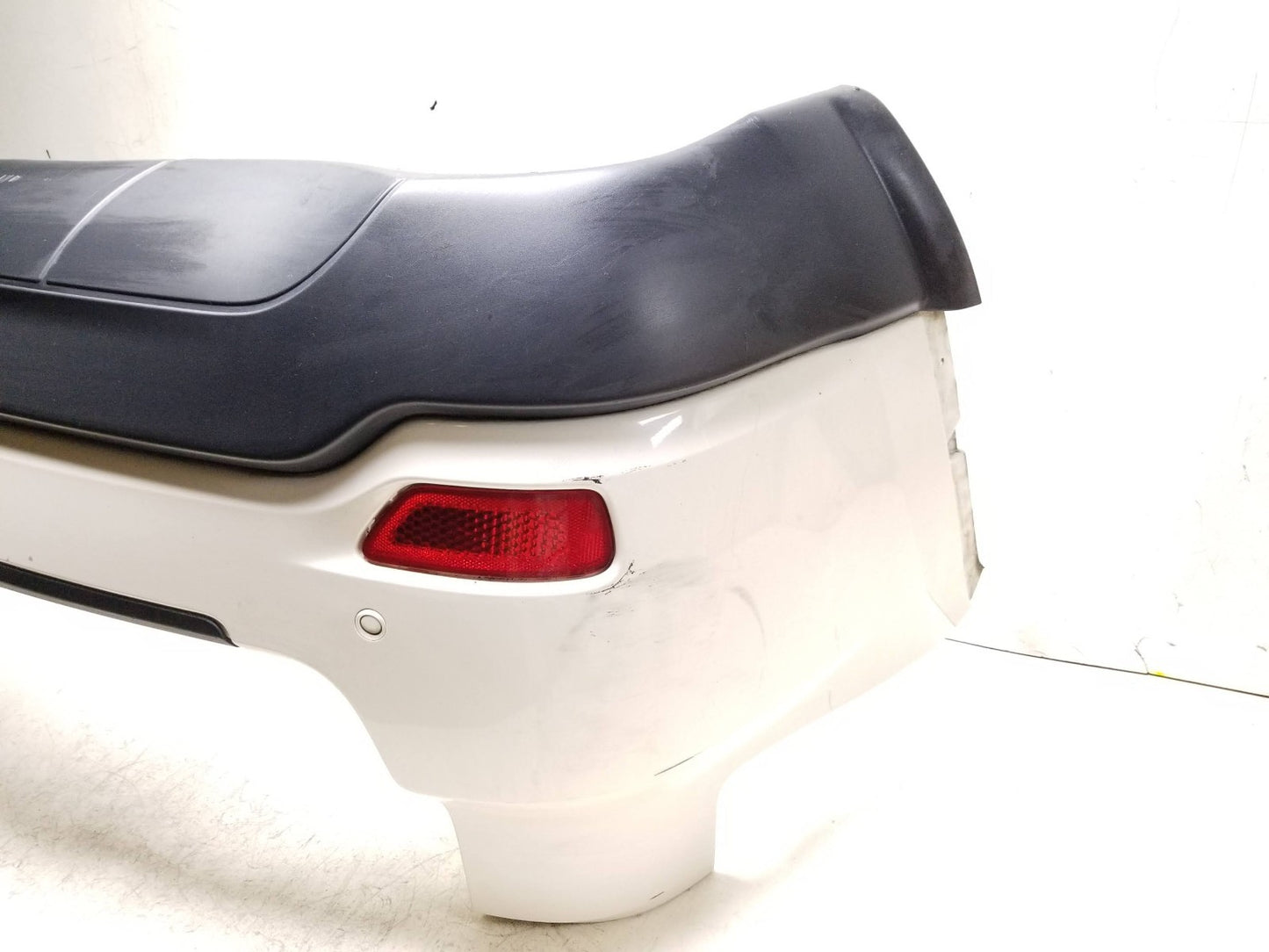 2011 - 2015 Jeep Grand Cherokee Rear Bumper Cover OEM
