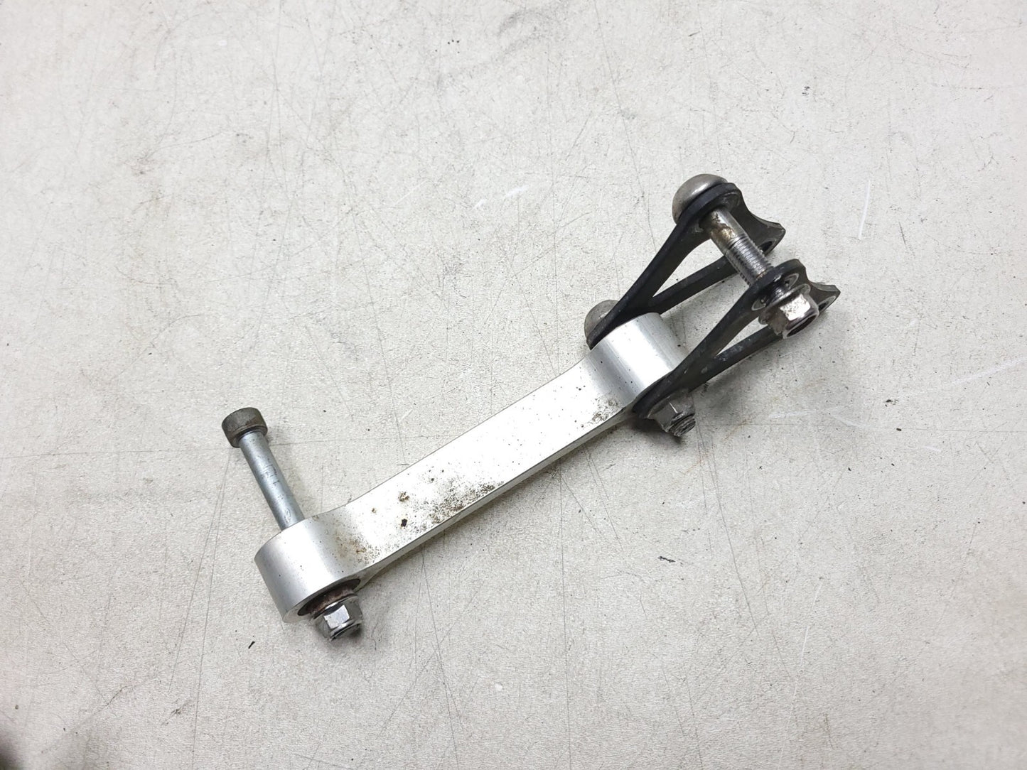 2009 - 2012 Triumph Street Triple R Rear Shock Linkage Dogbone Arm OEM