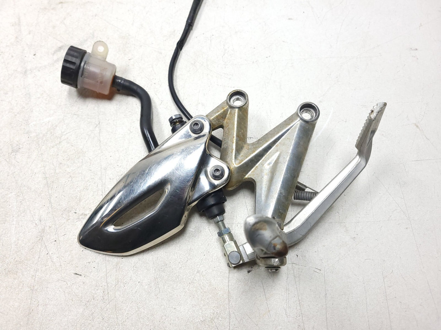 09-12 Triumph Street Triple R Front Right Foot Peg & Bracket W/master Cylinder
